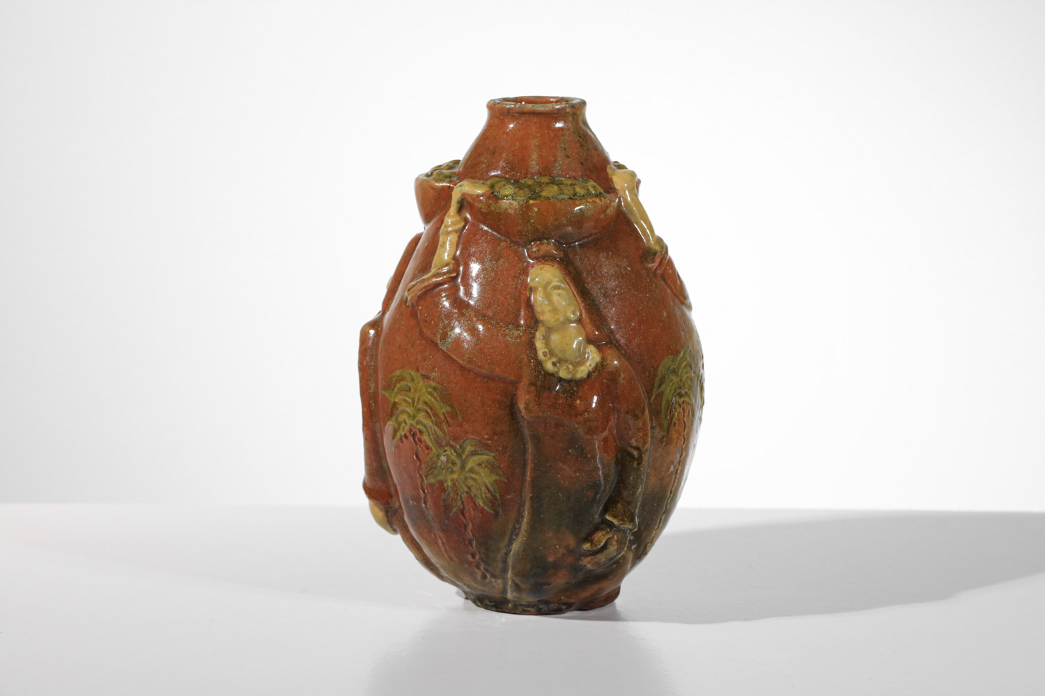 vase céramique Art déco à décors orientaliste massif bas-relief porteuse de fruits et palmiers style Paul Pouchol - J598 vase céramique Art déco à décors orientaliste massif bas-relief porteuse de fruits et palmiers style Paul Pouchol - J598