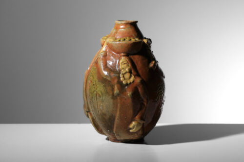 vase céramique Art déco à décors orientaliste massif bas-relief porteuse de fruits et palmiers style Paul Pouchol - J598